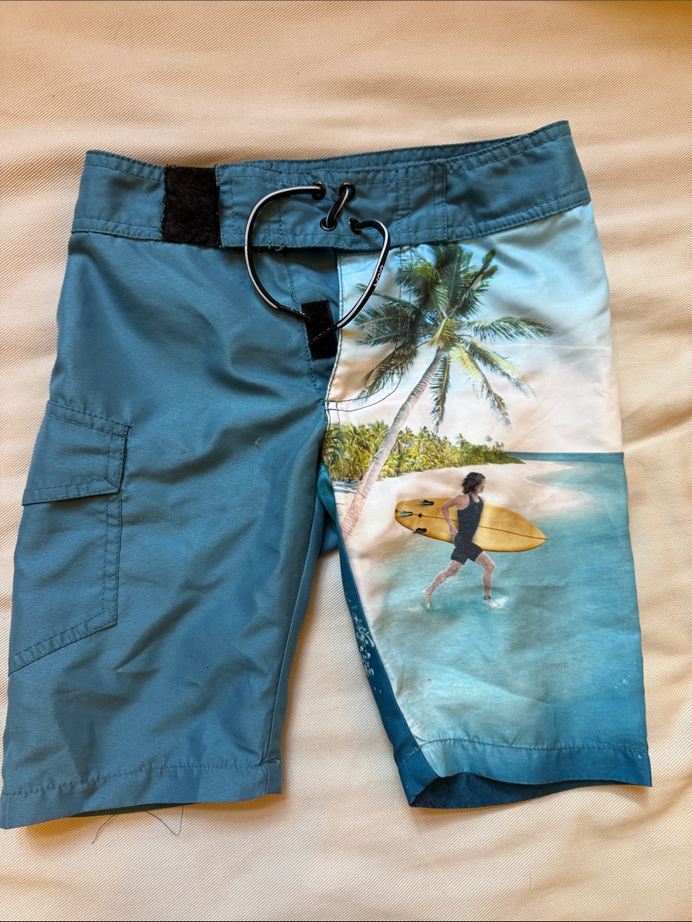 Molo Teal and Aqua Boys' Surf Scene Swim Trunks